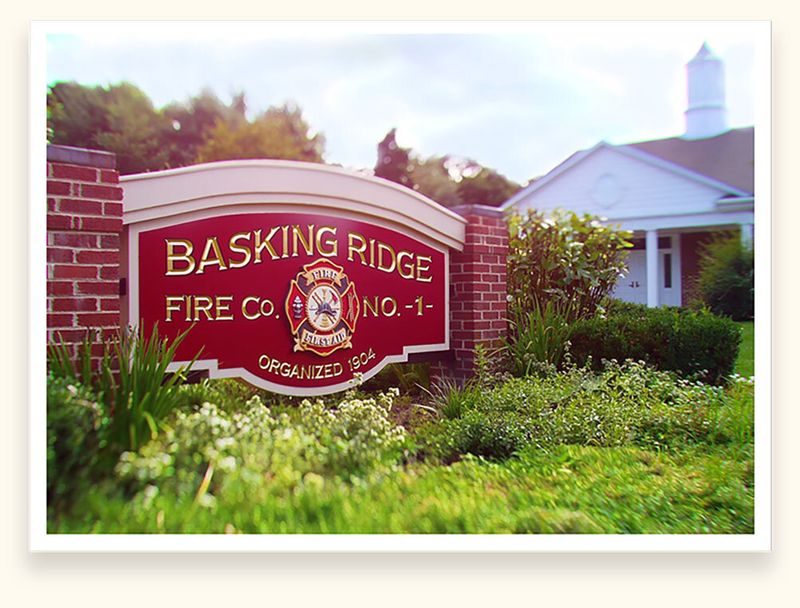 Crimson carved monument sign with gold lettering for Basking Ridge Fire Co. No. 1, organized 1904