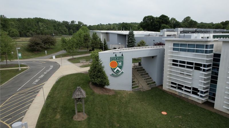 Aerial view of the Far Hills Country Day School crest sign installed on the campus entrance wall