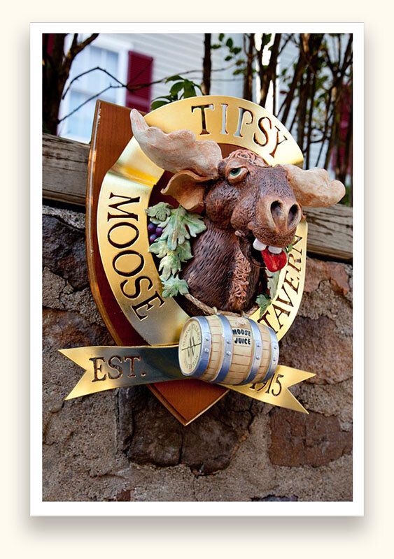 Sculpted moose head sign with a gold leaf oval and carved barrel for the Tipsy Moose Tavern